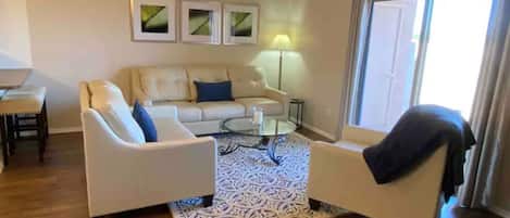 Living room has plenty of seating. Furniture is comfortable and high quality.