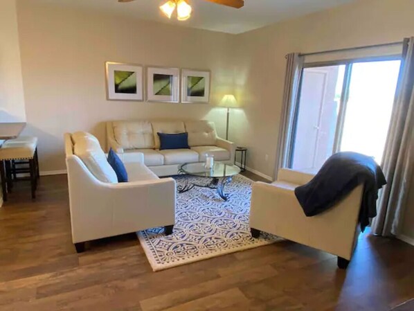 Living room has plenty of seating. Furniture is comfortable and high quality.