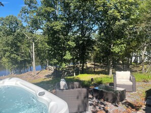Treat yourself to a luxurious hot tub with a view of the lake. 