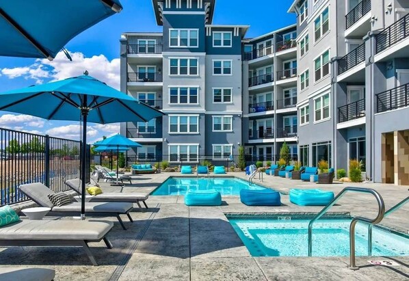 A year-round heated pool and jacuzzi overlooking the waterfront is a perfect way to relax with family and friends