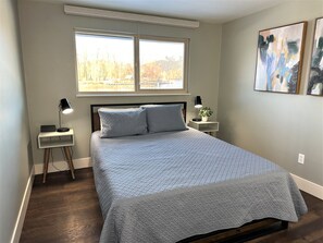 Second Bedroom with Queen bed and river view.