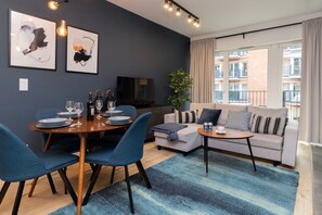 The elegant living room featuring a double sofa bed.
