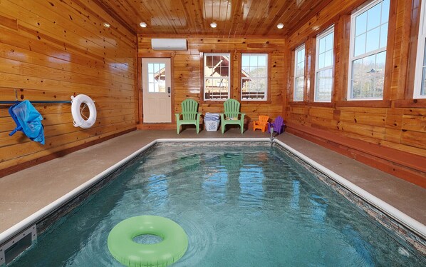 Indoor pool with mountain views, perfect for year-round relaxation.