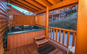 Private hot tub on covered deck for ultimate relaxation.