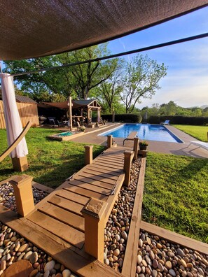 looking out from fire pit and dual hammocks