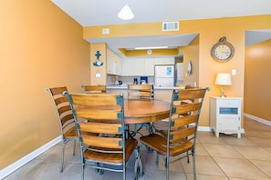 Dining table, snack bar, and kitchen