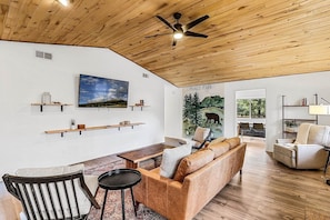 Family room highlights a beautiful mural that was hand painted by a local resident