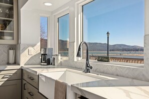 Modern updated kitchen with amazing views of the lake and granite counter tops.