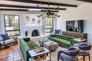 Stunning living room with plenty of seating, gas fireplace and smart tv.