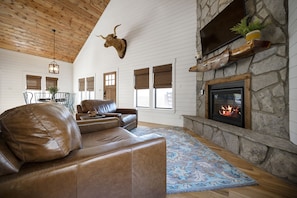 Luxury seating around a floor to ceiling fire place!