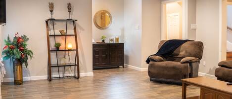 Main living room with a curved smart TV