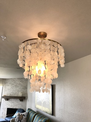 shell chandelier over the dining table