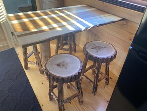 Dining table with four stools