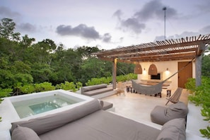 Fantastic terrace with unique views of the landscape. It features a jacuzzi, outdoor living and dining area.
