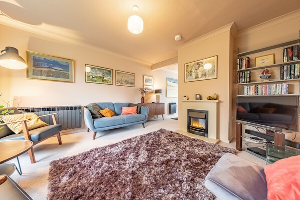 12 The Close, Brancaster Staithe: Sitting room with electric living flame fire