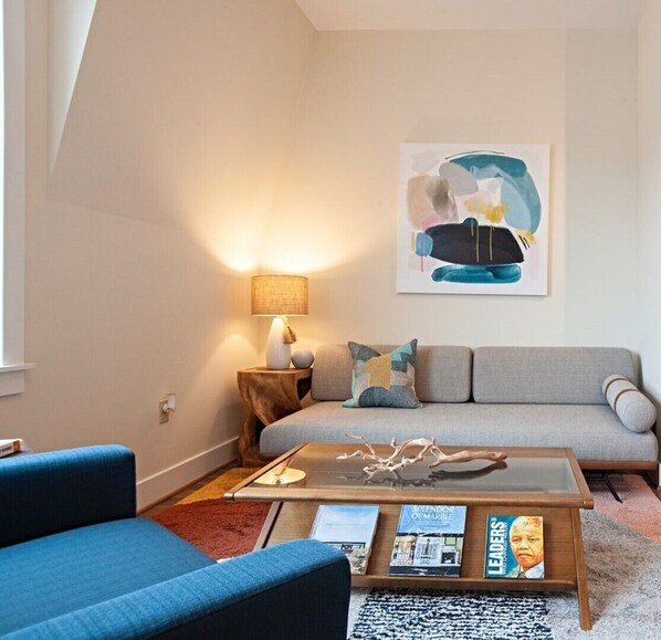 Relax in this welcoming living room space with a full window.