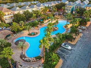 Resort style lagoon pool with hot tub. Pool area is also equipped with two waterfalls & self serve tiki bar