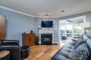 The sofa opens to a sleeper. The Sunroom sits just beyond the living area.