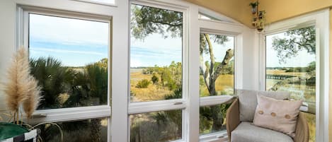 Floor to ceiling windows give you unparalleled views of the marsh, creek, boats & marina! Watch spectacular sunsets from here!