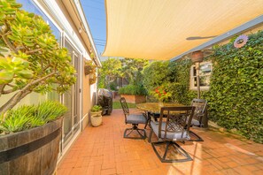 Market lights, gas grill and lush garden.