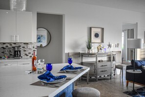 Dining options at kitchen island/counter, view of open concept living room