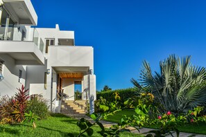 Front yard view and beautiful manicured landscape, lower and upper villa