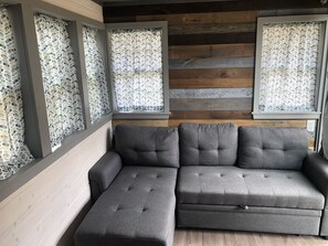 Living Area Featuring Couch Convertible to Bed!