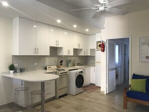 Open kitchen with Bar Counter and Stools