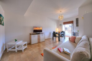 Living room-kitchen with sofa bed and Smart TV