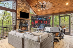 Enjoy movie nights on the porch by the fireplace