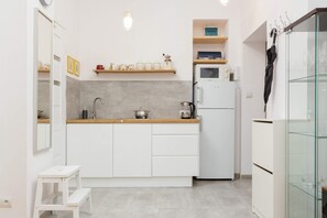 The fully equipped kitchenette includes everything you need for a home-cooked meal.