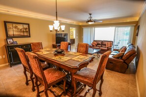 Cozy Family Dining Area - Gathering for a family meal is a must while on vacation. Whether it's homemade or take-out, enjoy it around the spacious dining table at >PROPERTY<.