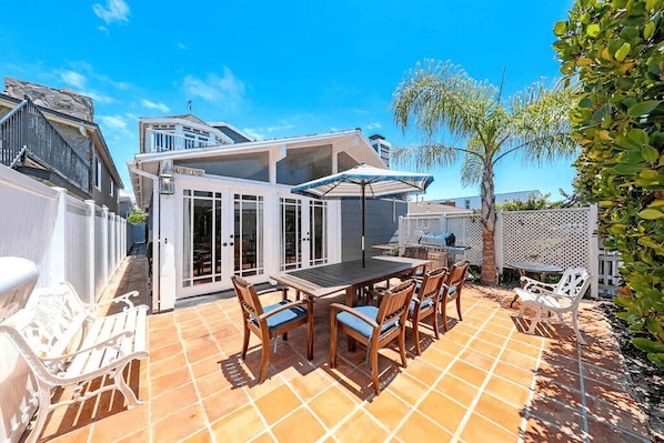 This private and cheery front patio includes seating for 6-8 along with additional seats for soaking up the sun.