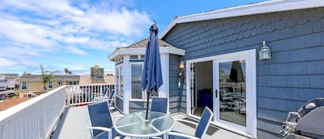 Patio doors from the living room open up to the best deck in Newport Beach! Enjoy views of the Pacific as well as fresh ocean breezes.