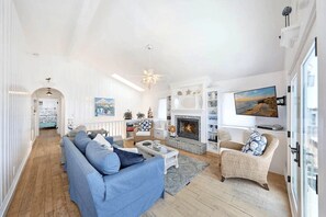The magic is in the details! This beach home is bright and cheery, but also cozy and snug. Open the patio doors for an ocean breeze, or turn on the fire and TV for a comfy night in.
                