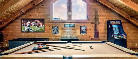 Game room with Pool table, Foosball, Arcade Machines, board games & TV