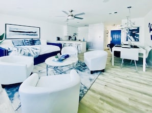 Plush living area with coffee table & additional seating.