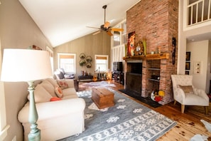 Living area with 55" TV, Huge Fireplace. Loft