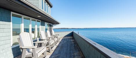 Back Deck Overlooking Ocean View- 4 deck high Adirondack chairs.
