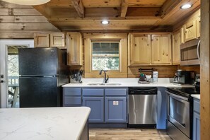 New marble counter tops and fully stocked kitchen