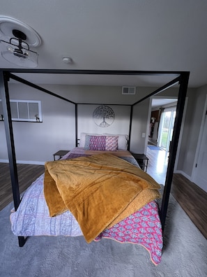 Master bedroom with queen bed and availability for an additional queen mattress.