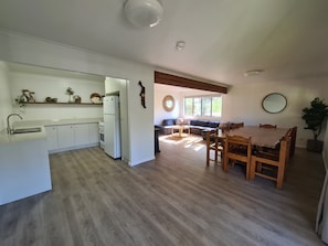 Kitchen, living and dining area as you enter front door 