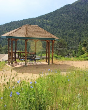 Enjoy morning coffee, lunch, or dinner under the sheltering gazebo.