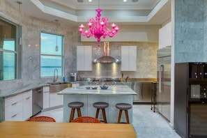 Kitchen with bright pink Verano chandelier