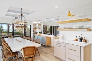 Large dinner table adjoined by a bar area, perfect for hosting the perfect family dinner