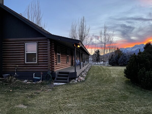 Beautiful sunset in the Heber Valley area with a great  log cabin type home.