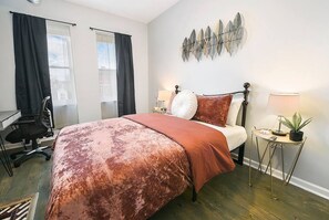 Spacious and light-filled bedroom.