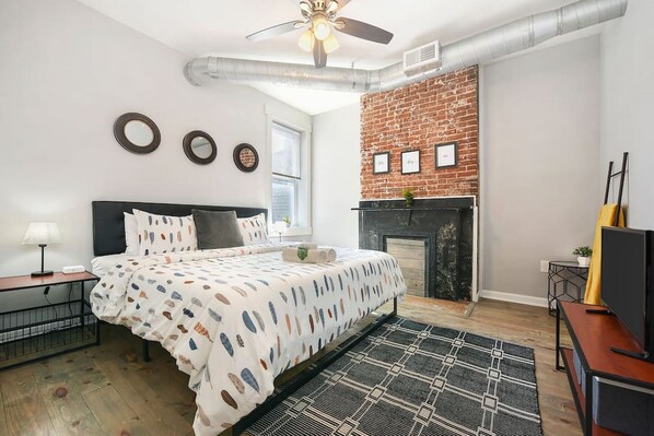 Unwind in the spacious master bedroom with a king-size bed.