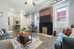 Settle into the living area, perfect for movie nights or remote work.
