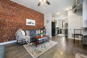Gather around the coffee table for conversation and relaxation.